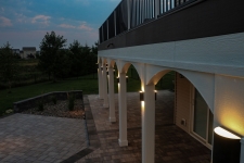 Deck with lighting near arches