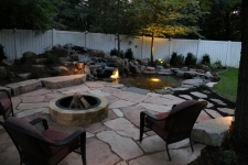 flagstone patio with water feature and lighting