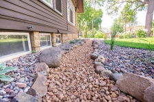 Rock and plant beds around house